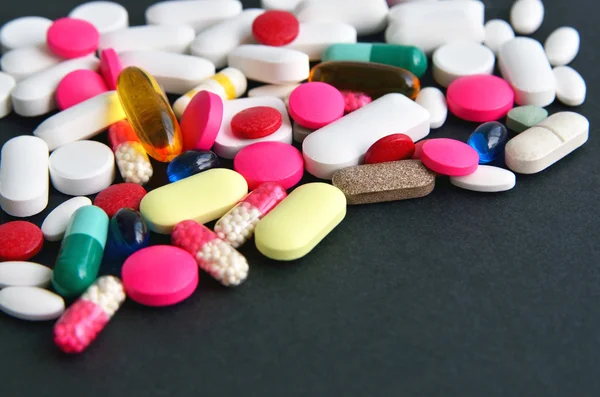 Assorted colored pills and capsules — Stock Photo, Image