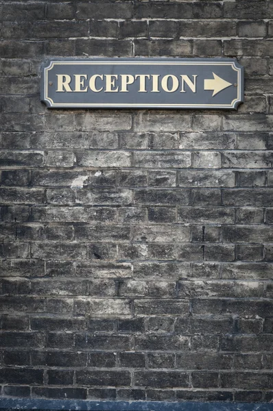 Receptions sign on brick wall — Stock Photo, Image
