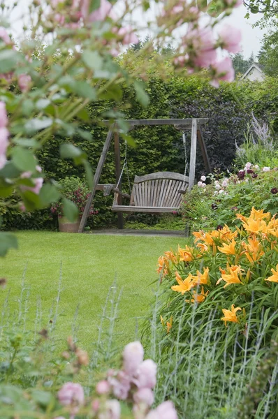 Wooden garden swing — Stock Photo, Image