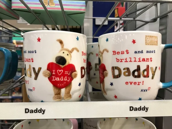 Auckland NZ 2 sep 22: Mugs for father\'s day beautiful cute decoration Best daddy in the world row of mugs and cups on shelves in bookstore