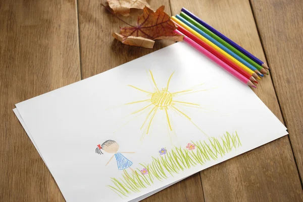 Kid's picture on the wooden table — Stock Photo, Image