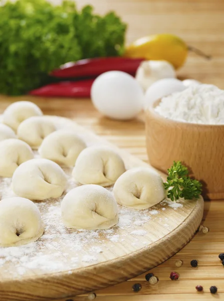 Meat dumplings on the kitchen board — Stock Photo, Image