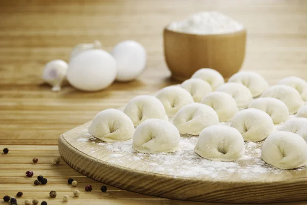 Meat dumplings on the kitchen board — Stock Photo, Image