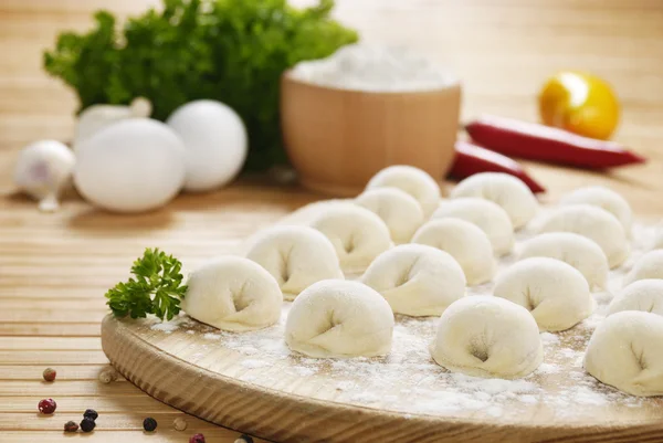 Meat dumplings on the kitchen board — Stock Photo, Image