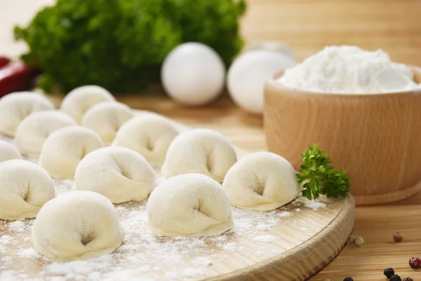 Meat dumplings on the kitchen board — Stock Photo, Image