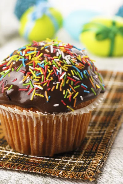 Chocolate muffin with sprinkles — Stock Photo, Image