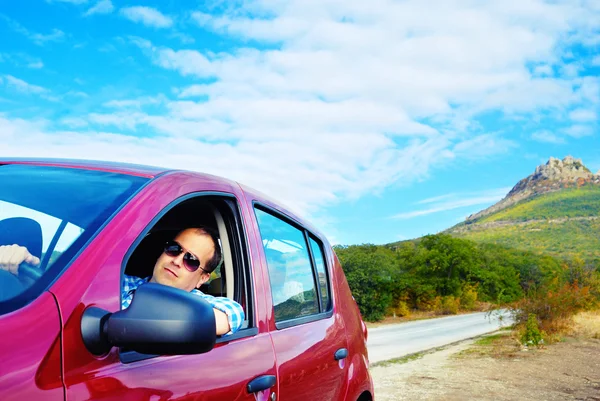 Adult man is driving his car — Stock Photo, Image