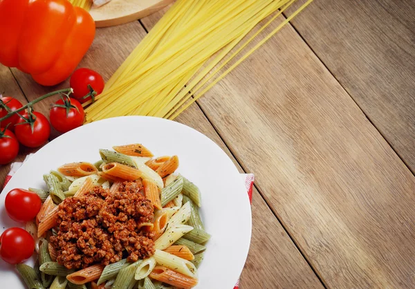 Pasta bolognese on the wooden table — Stock Photo, Image