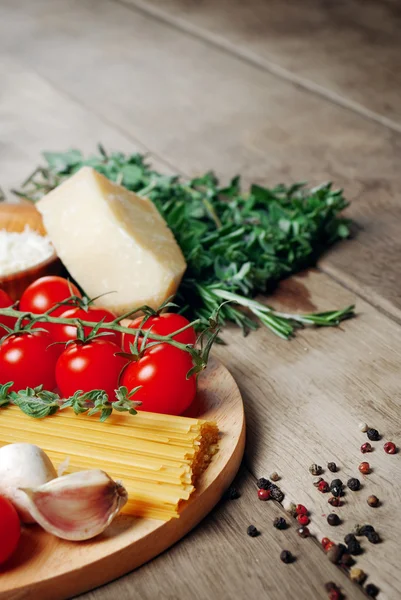 Pasta ingredients on the wooden table — Stock Photo, Image