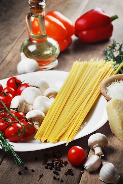 Pasta ingredients on the wooden table — Stock Photo, Image
