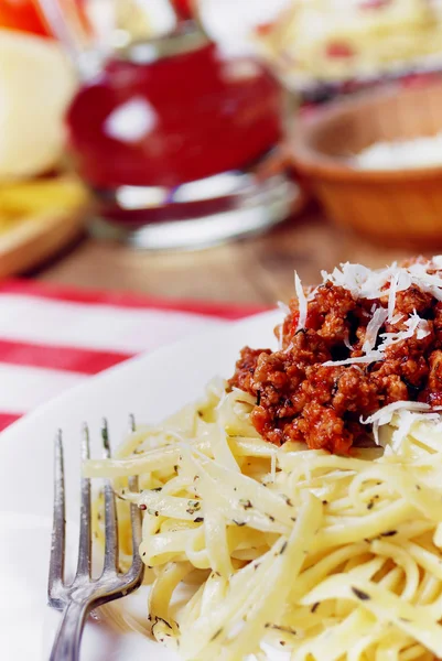 Pasta bolognese on the wooden table — Stock Photo, Image