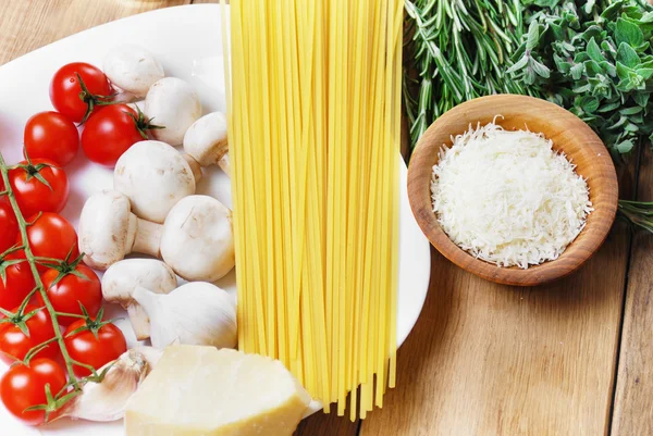 Pasta ingredients on the wooden table — Stock Photo, Image