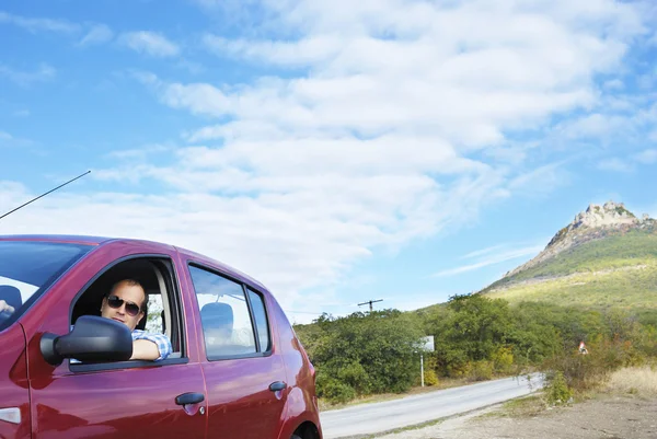 Adult man is driving his car — Stock Photo, Image