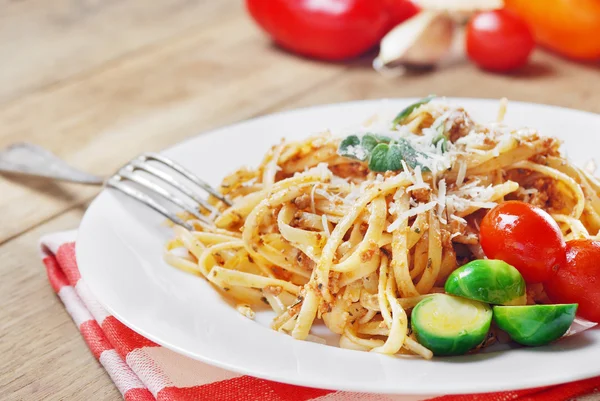 Pasta bolognese on the wooden table — Stock Photo, Image