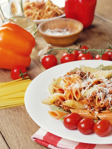 Pasta bolognese on the wooden table — Stock Photo, Image