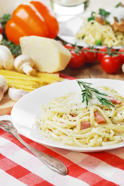 Pasta carbonara on the wooden table — Stock Photo, Image