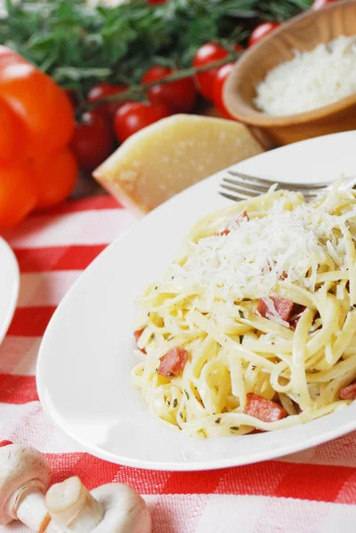 Pasta carbonara on the wooden table — Stock Photo, Image
