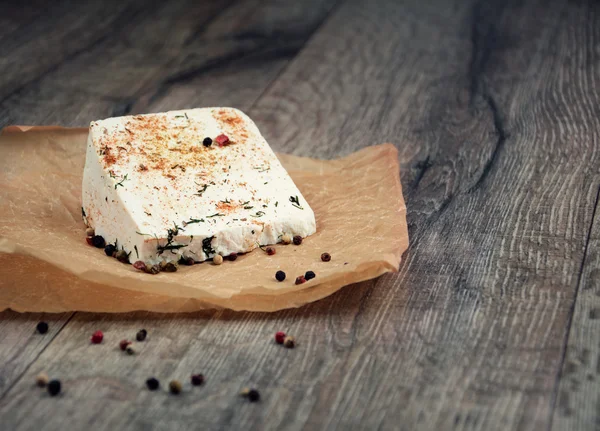Tasty old peace of cheese on the table — Stock Photo, Image