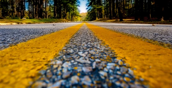 Close up of yellow lines on road