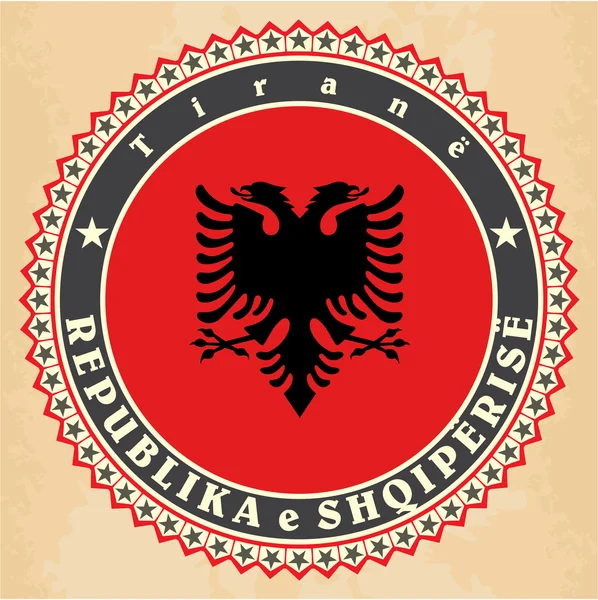 アルバニアの旗のヴィンテージ ラベル カード. — ストックベクタ