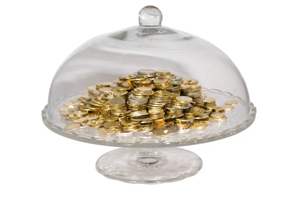 Glass cake stand with coins — Stock Photo, Image