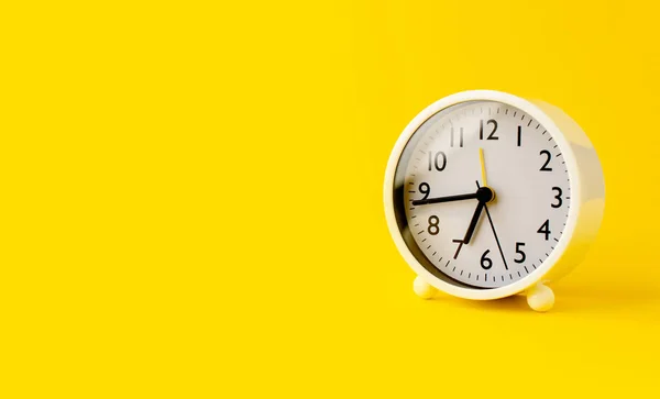 White Alarm Clock Telling Time Set Yellow Background Concept Importance — Stock Fotó