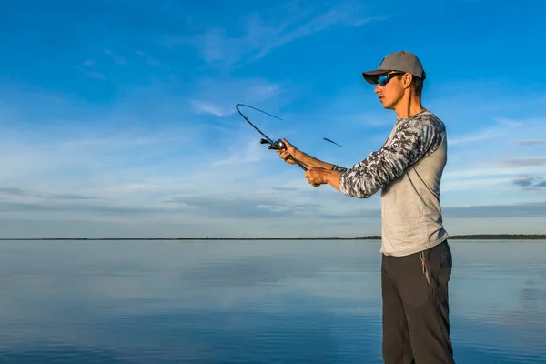 Fishing Casting Fisherman Cast Baitcasting Spinning Rod Lake Blue Sky — Zdjęcie stockowe