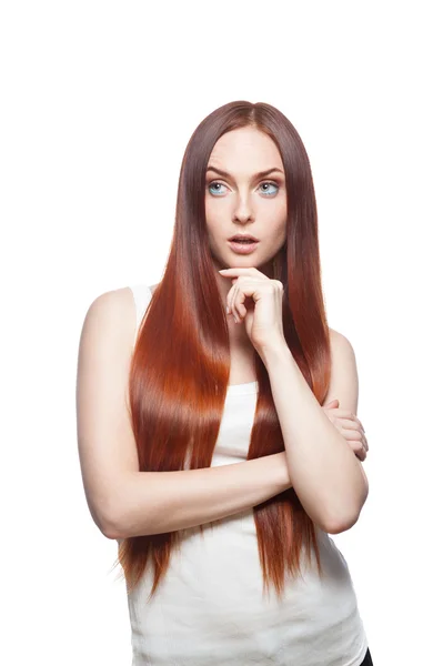 Thoughtful casual red-haired female on white — Stock Photo, Image