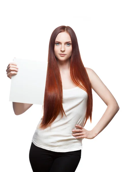 Female in casual outfit holding sign — Stock Photo, Image