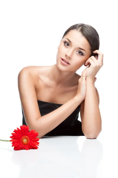 Young brunette female with gerbrera flower — Stock Photo, Image