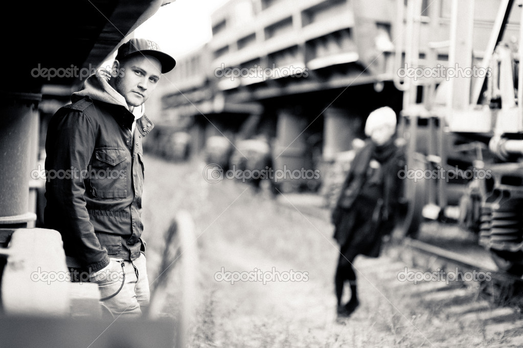 Young couple near freight trains