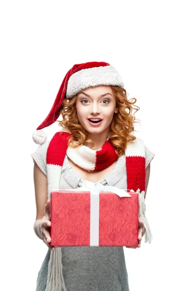Young red-haired surprised girl holding christmas gift — Stock Photo, Image
