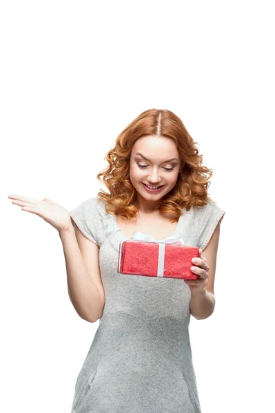 Young surprised happy smiling girl holding gift — Stock Photo, Image