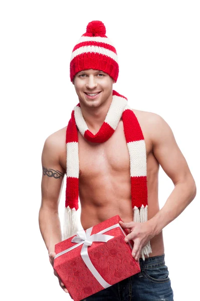 Seksowny macho trzymając czerwony prezent — Zdjęcie stockowe