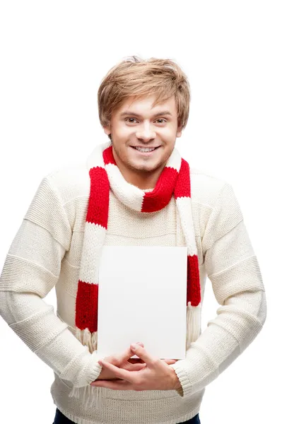 Young cheerful happy man holding sign — Stock Photo, Image