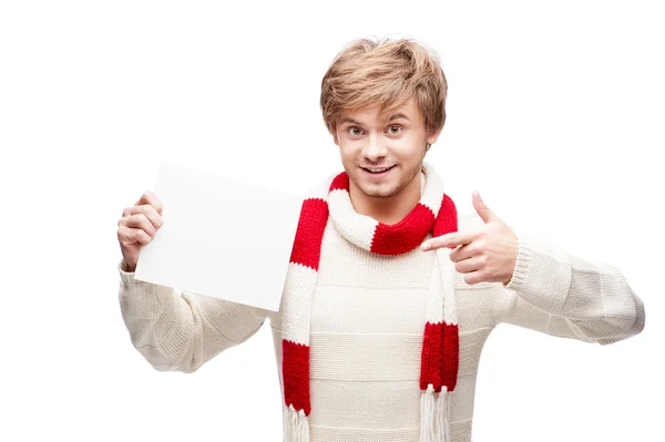 Young smiling man pointing at sign — Stock Photo, Image