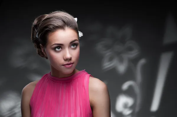 Young woman with flowers in hair — Stock Photo, Image