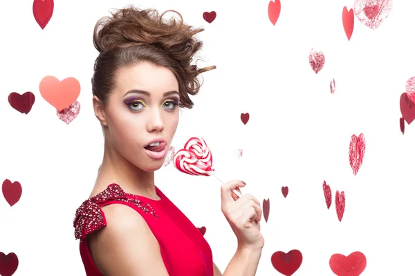 Brunette woman holding lollipop — Stock Photo, Image