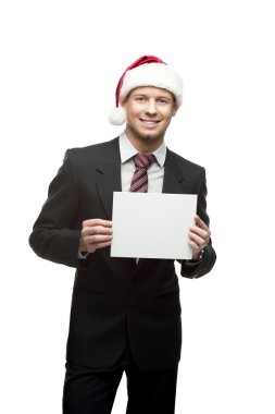 santa şapka işareti tutarak içinde gülümseyen iş adamı