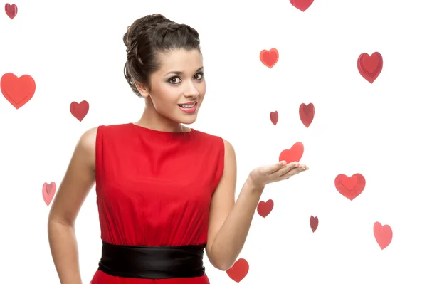 Young cheerful woman holding red paper heart — Stock Photo, Image