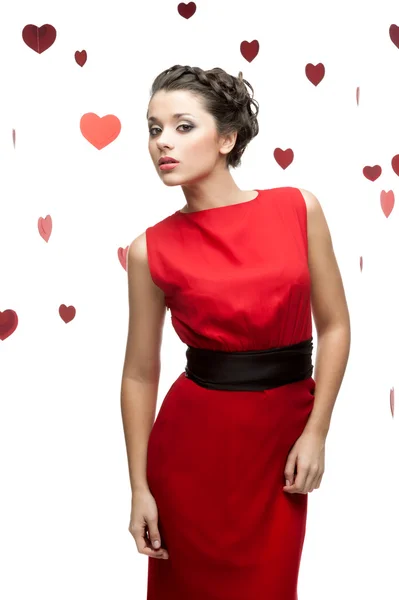 性感时尚女人在红纸的心背景 — 图库照片