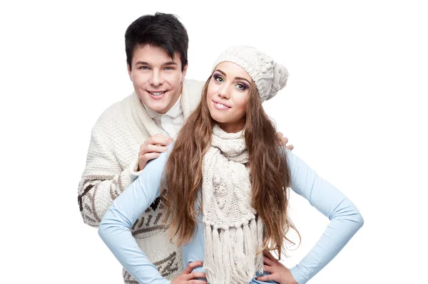 Young smiling couple in winter clothing embracing — Stock Photo, Image