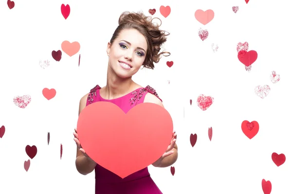 Brunette woman holding big red paper heart — Stock Photo, Image