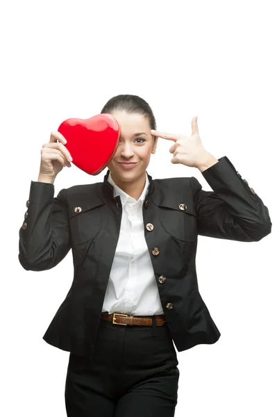 Young cheerful businesswoman holding red heart — Stock Photo, Image