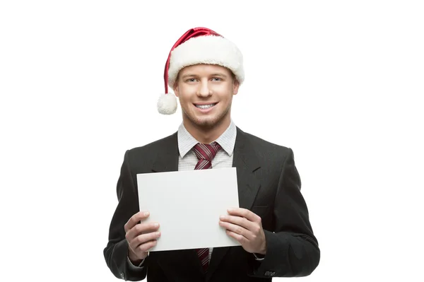 Biznesmen w santa hat gospodarstwa znak — Zdjęcie stockowe