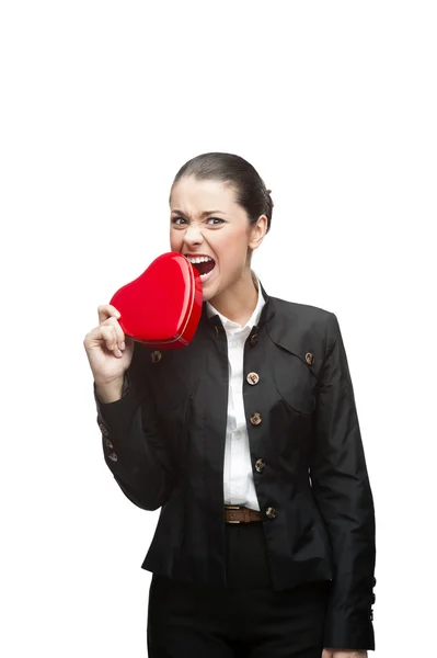 Young cheerful businesswoman holding red heart Stock Image