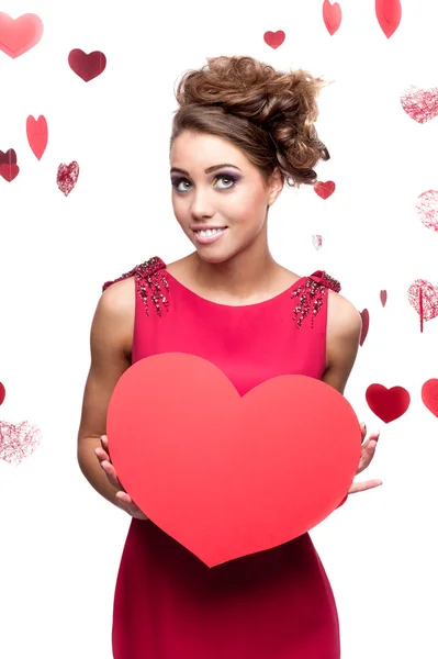 Young cheerful woman holding red paper heart — Stock Photo, Image