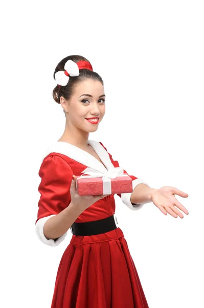 Cheerful retro girl holding christmas gift — Stock Photo, Image