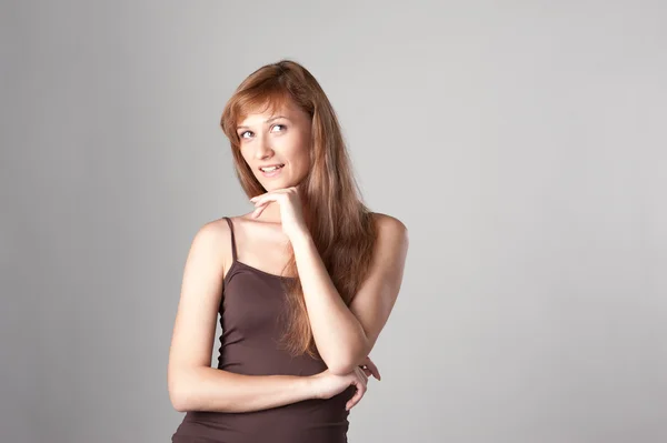 Cheerful casual girl on gray — Stock Photo, Image