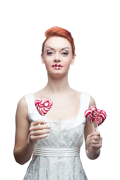 Glückliches rothaariges Mädchen mit Süßigkeiten — Stockfoto